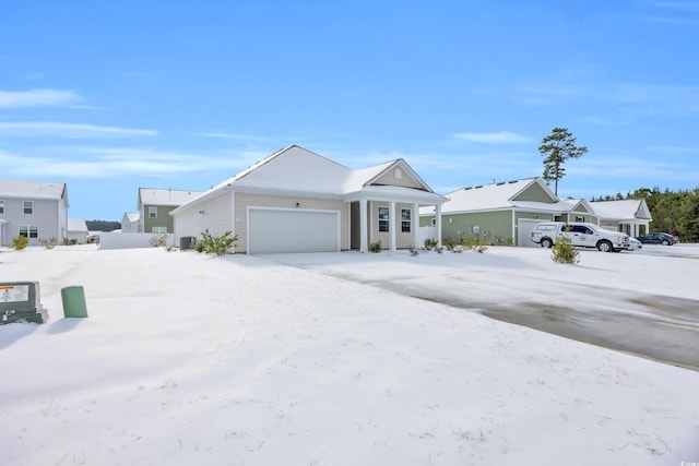 view of front of property featuring an attached garage and a residential view