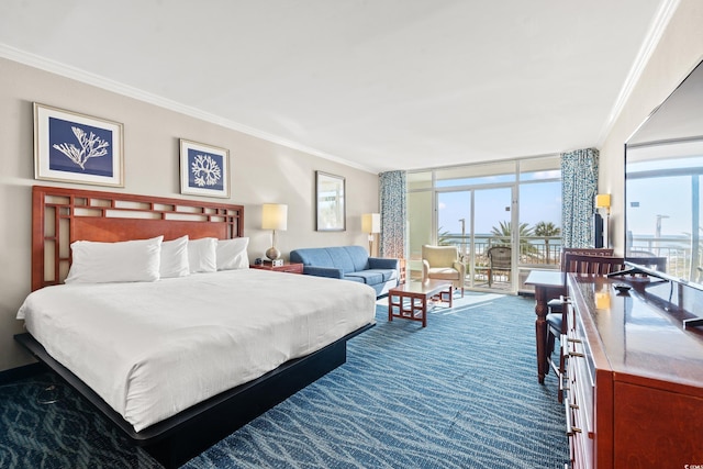 carpeted bedroom featuring access to exterior, ornamental molding, and floor to ceiling windows