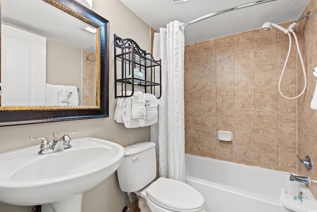 full bathroom featuring shower / tub combo, toilet, and sink