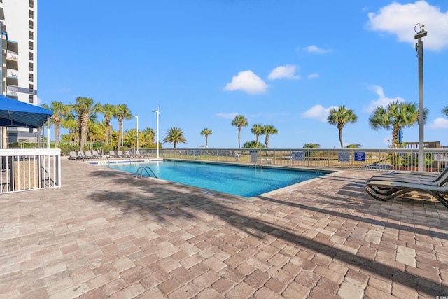 view of pool featuring a patio