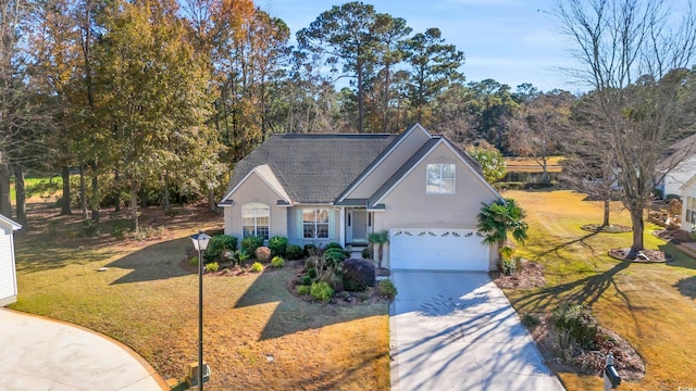 view of front of home featuring a garage and a front lawn