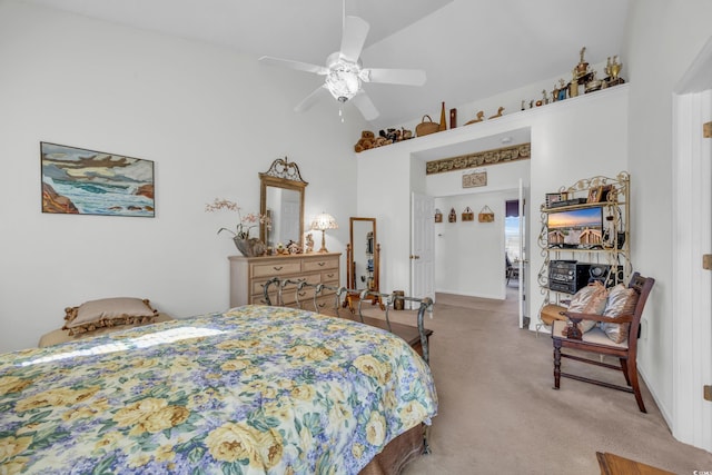 bedroom featuring vaulted ceiling, light carpet, and ceiling fan