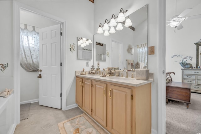 bathroom with ceiling fan and vanity