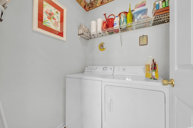 laundry room with washing machine and clothes dryer