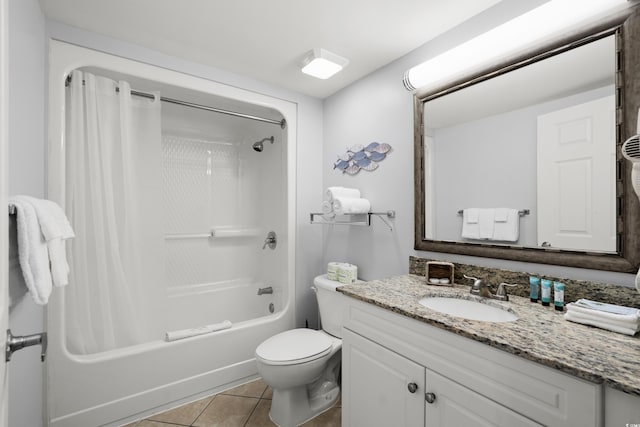 full bathroom with vanity, tile patterned floors, toilet, and shower / bath combo