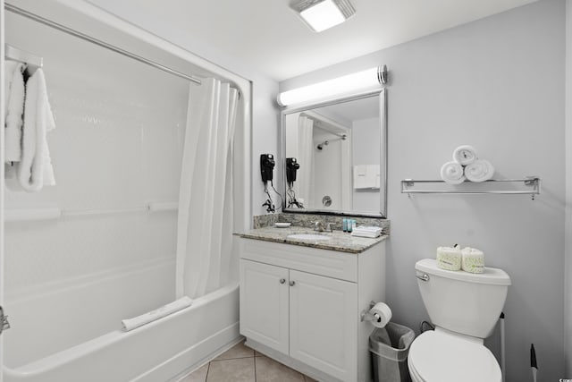 full bathroom with tile patterned flooring, vanity, shower / bath combo with shower curtain, and toilet