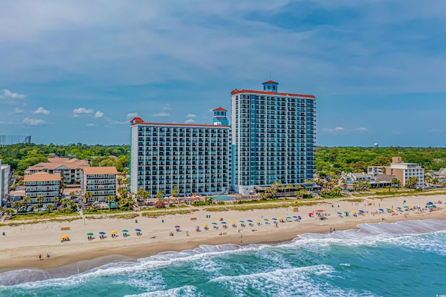 bird's eye view featuring a water view and a view of the beach