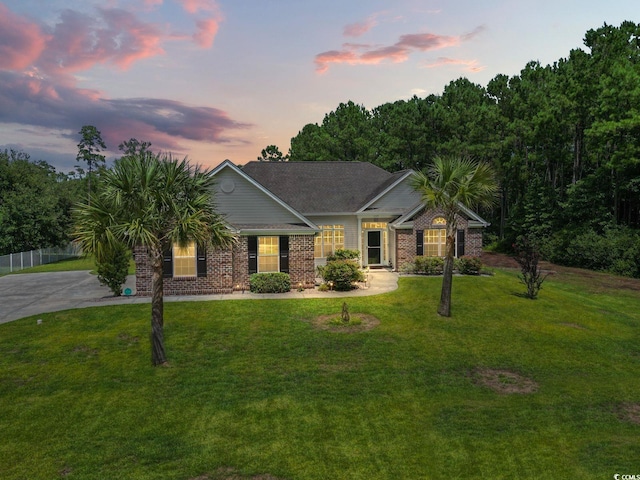 view of front of home with a lawn