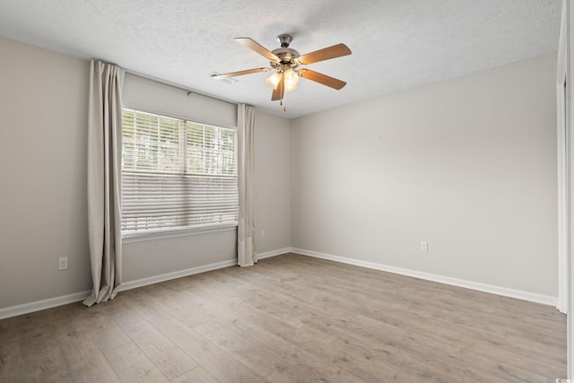 unfurnished room with ceiling fan, a textured ceiling, and light hardwood / wood-style floors