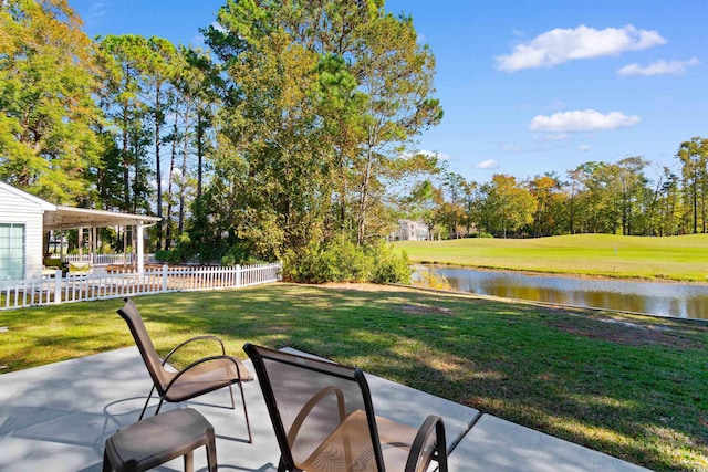 view of yard with a patio and a water view