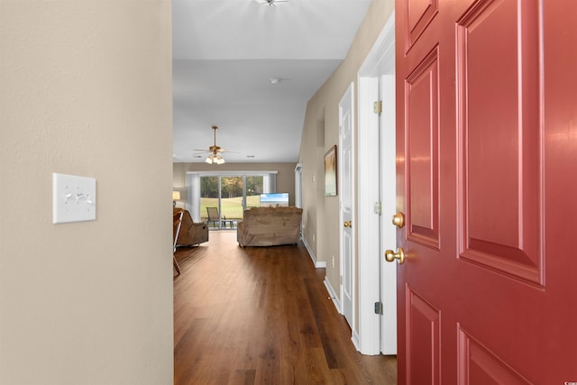 foyer with dark hardwood / wood-style flooring and ceiling fan