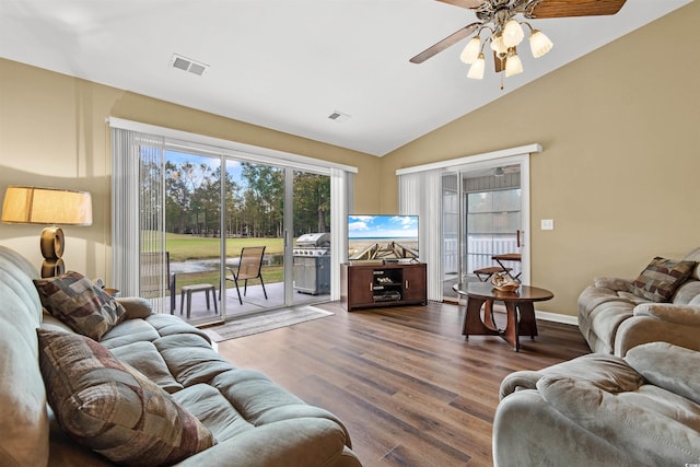 living room featuring ceiling fan, lofted ceiling, and dark hardwood / wood-style flooring