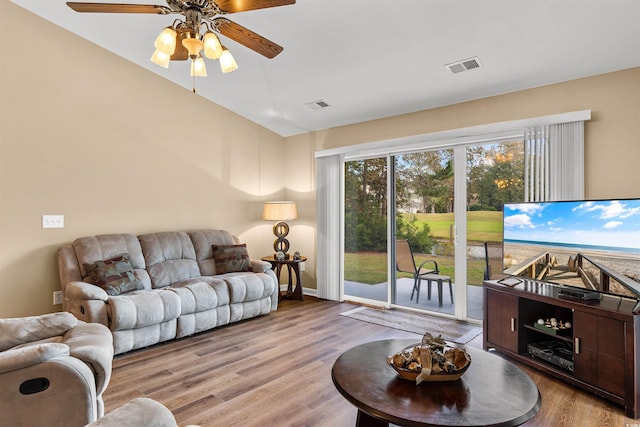 living room featuring light hardwood / wood-style flooring and ceiling fan