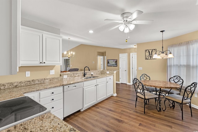 kitchen featuring hanging light fixtures, white cabinetry, sink, and white dishwasher