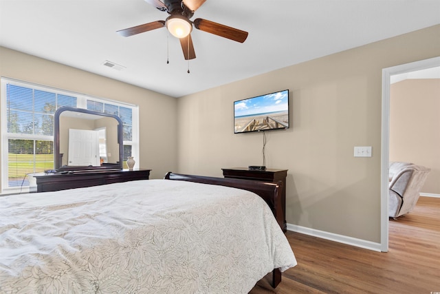 bedroom with hardwood / wood-style flooring and ceiling fan