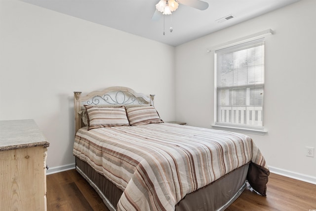 bedroom featuring ceiling fan and dark hardwood / wood-style flooring