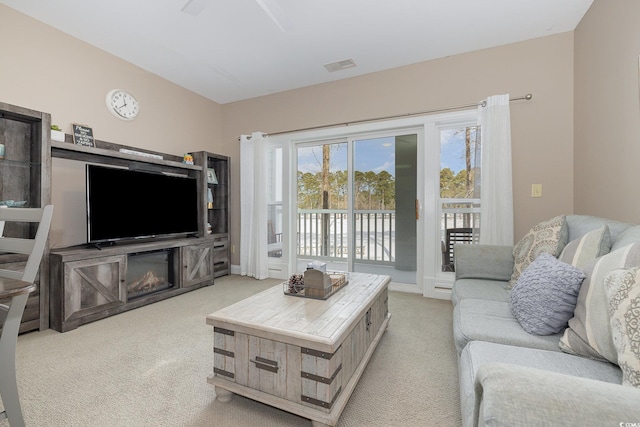 living room featuring light carpet