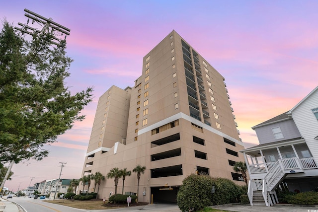 view of outdoor building at dusk