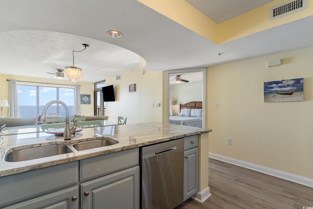 4103 N Ocean Blvd Unit 504, North Myrtle Beach, SC 29582 - kitchen featuring a ceiling fan, dishwasher, gray cabinetry, a sink, and baseboards