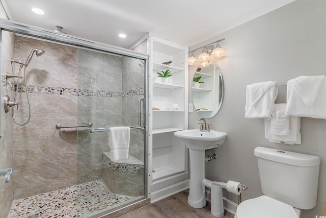 bathroom featuring walk in shower, wood-type flooring, and toilet