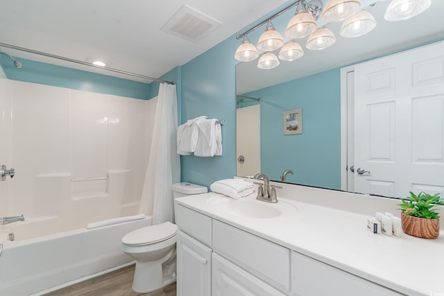 full bathroom with shower / tub combo with curtain, wood-type flooring, toilet, and vanity