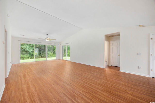 unfurnished room featuring ceiling fan, lofted ceiling, and light hardwood / wood-style flooring