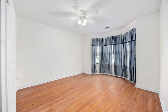 unfurnished room with ceiling fan and light hardwood / wood-style floors