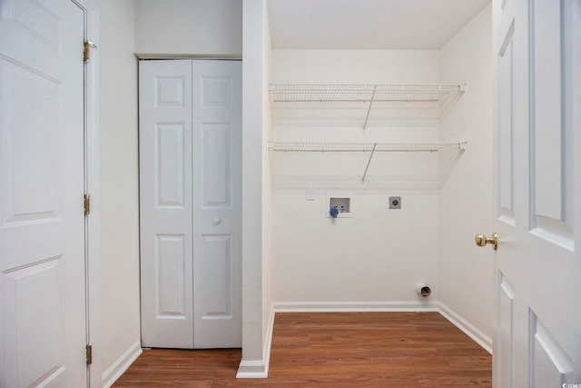 washroom featuring hookup for an electric dryer, hookup for a washing machine, and hardwood / wood-style floors