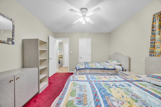 bedroom featuring a textured ceiling, ceiling fan, and carpet