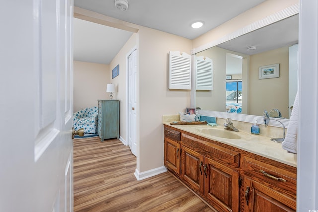 bathroom featuring vanity and hardwood / wood-style floors