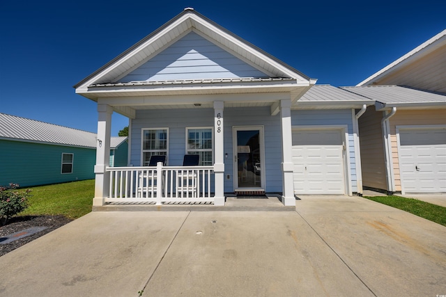 view of front of property with a garage and a porch