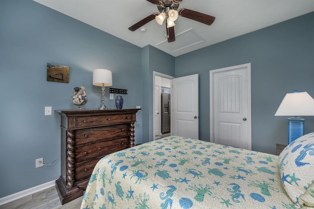 bedroom with ceiling fan and light wood-type flooring