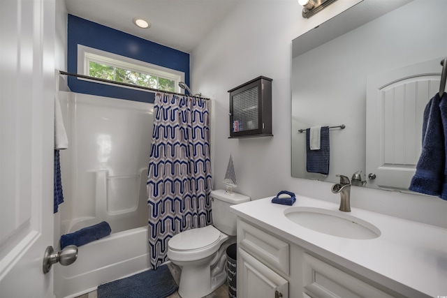 full bathroom featuring vanity, shower / bath combination with curtain, and toilet