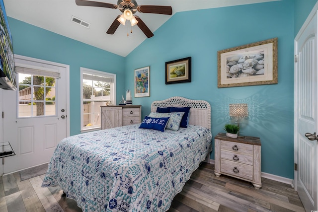 bedroom featuring lofted ceiling, dark hardwood / wood-style flooring, and ceiling fan