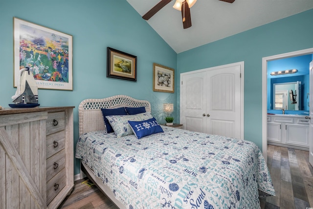 bedroom with vaulted ceiling, dark wood-type flooring, ensuite bath, and a closet