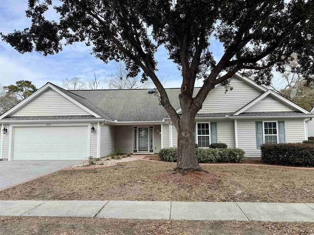 ranch-style home with a garage and a front lawn