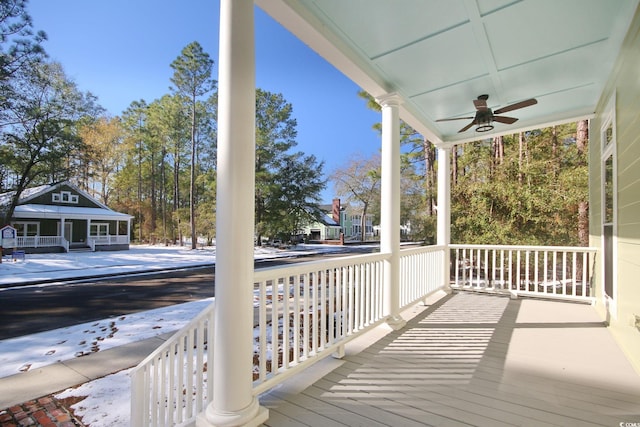 deck featuring a porch and ceiling fan