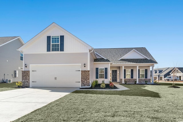 view of front of property featuring central AC unit, a garage, a front lawn, and covered porch