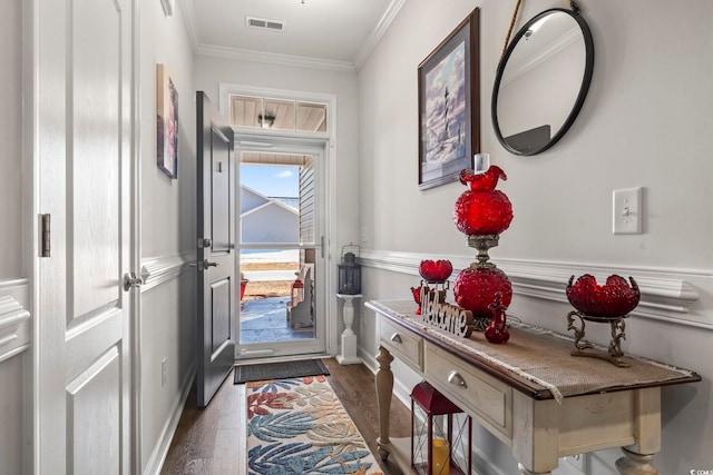 doorway to outside featuring dark hardwood / wood-style flooring and ornamental molding