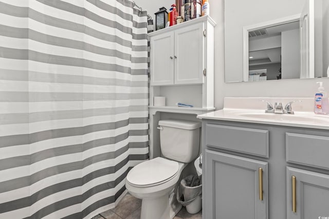 bathroom featuring vanity, toilet, and a shower with shower curtain