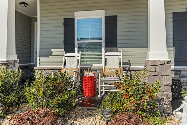 doorway to property with a porch