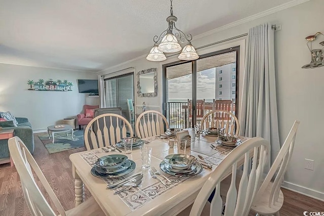 dining space featuring crown molding and wood-type flooring