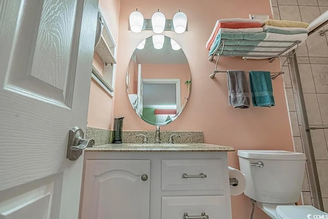 bathroom featuring vanity and toilet