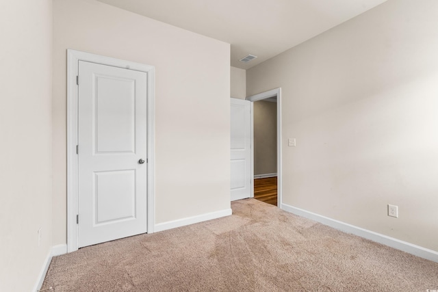 unfurnished bedroom with carpet floors