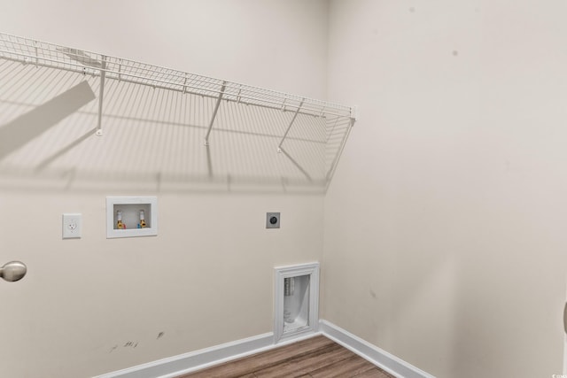 laundry area featuring washer hookup, wood-type flooring, and electric dryer hookup