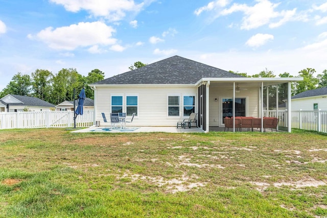 back of house featuring ceiling fan, a yard, an outdoor living space, and a patio