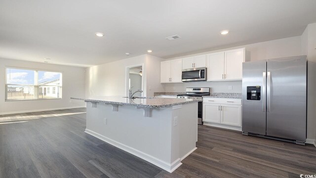 3489 Ashridge Way, Conway, SC 29526 - kitchen featuring white cabinetry, appliances with stainless steel finishes, dark hardwood / wood-style floors, and a kitchen island with sink