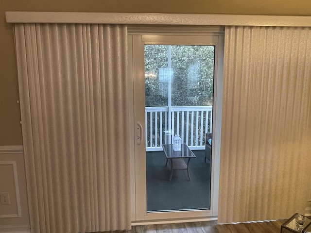 doorway to outside featuring hardwood / wood-style flooring