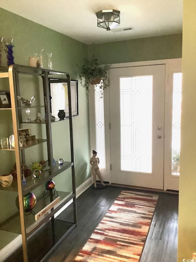 interior space with dark hardwood / wood-style floors