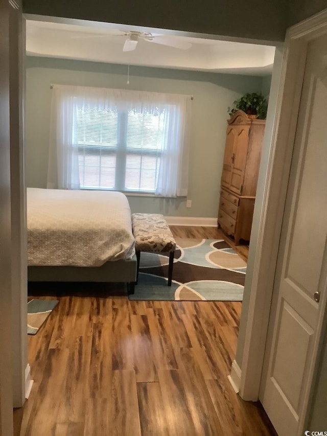 bedroom with wood-type flooring